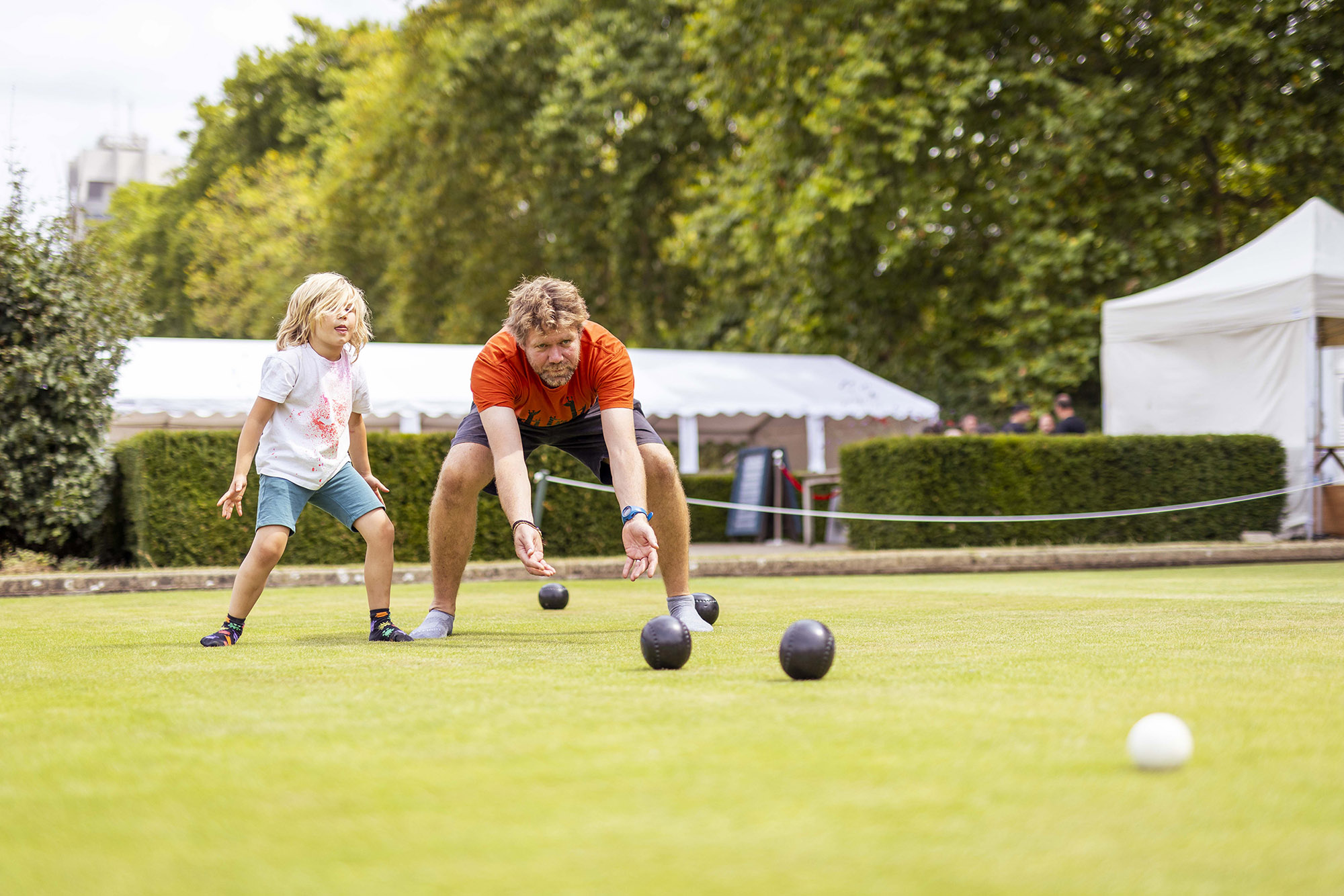 Family enjoying lawn bowls at Park Sports Hyde Park