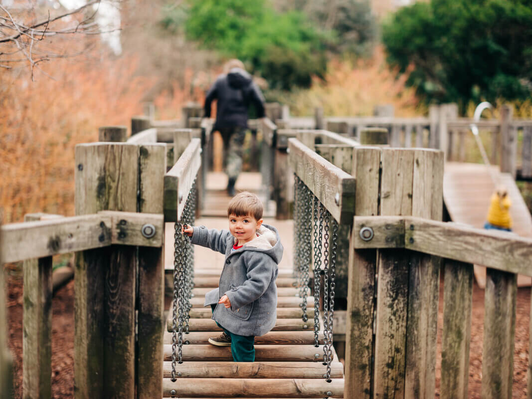 Boy playing on bridge at Diana Playground