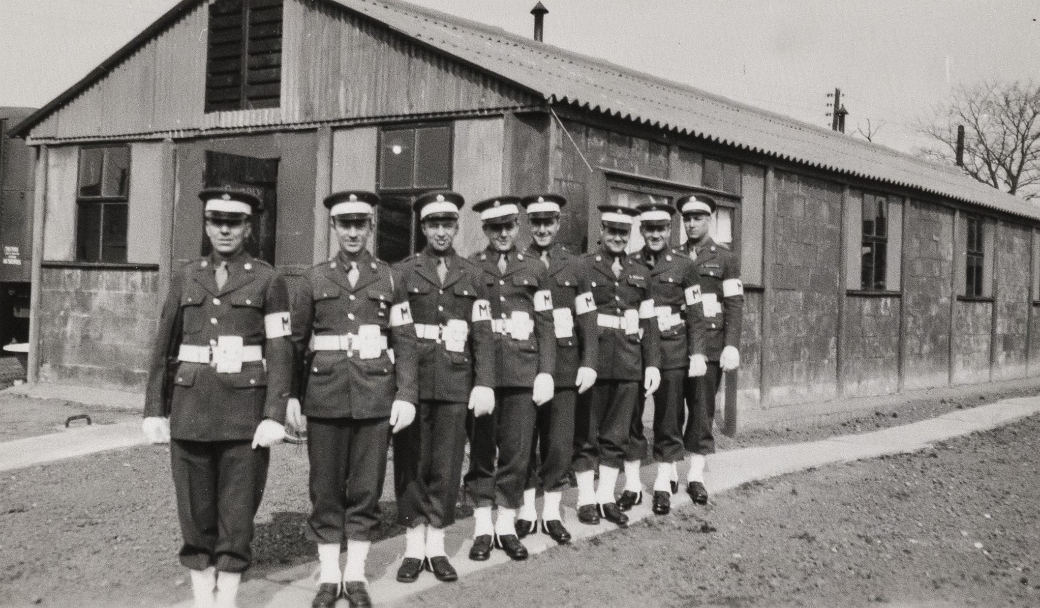 Officers standing in a row outside a building in Camp Griffiss