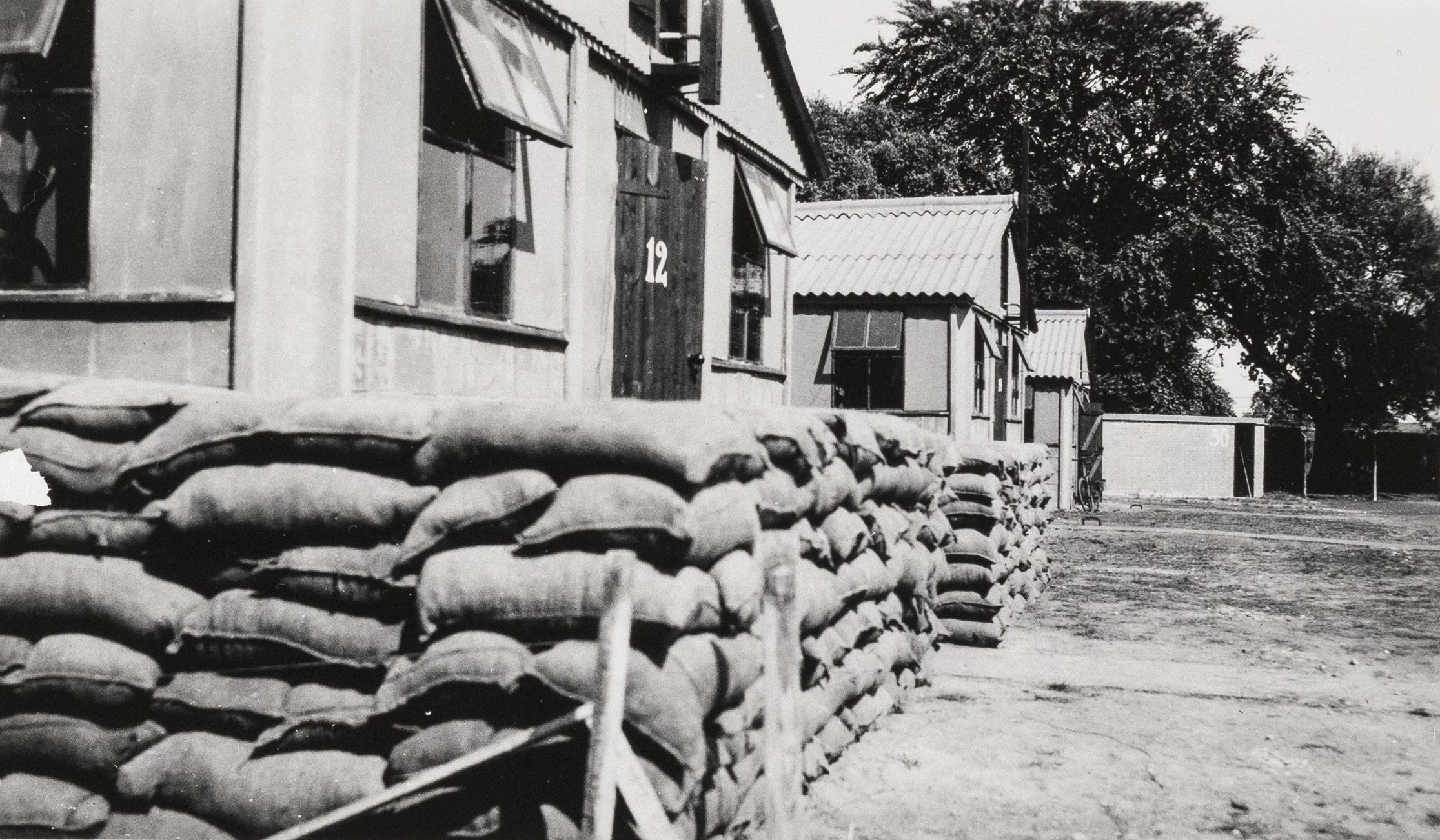 Brick buildings in Camp Griffiss with sandbags, Bushy Park