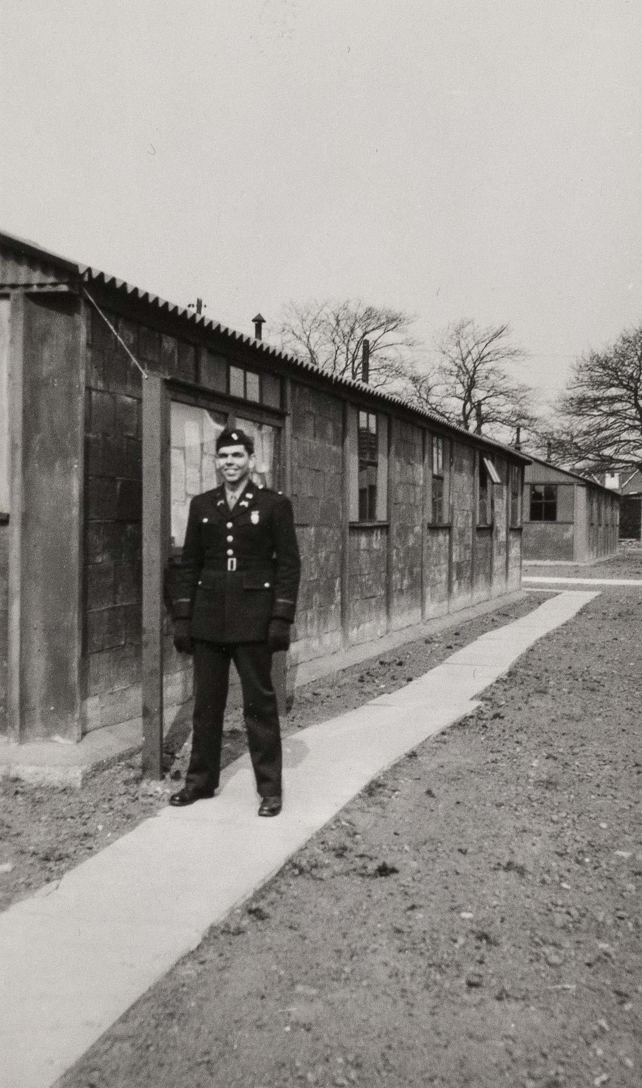 Officer standing outside a brick building in Camp Griffiss