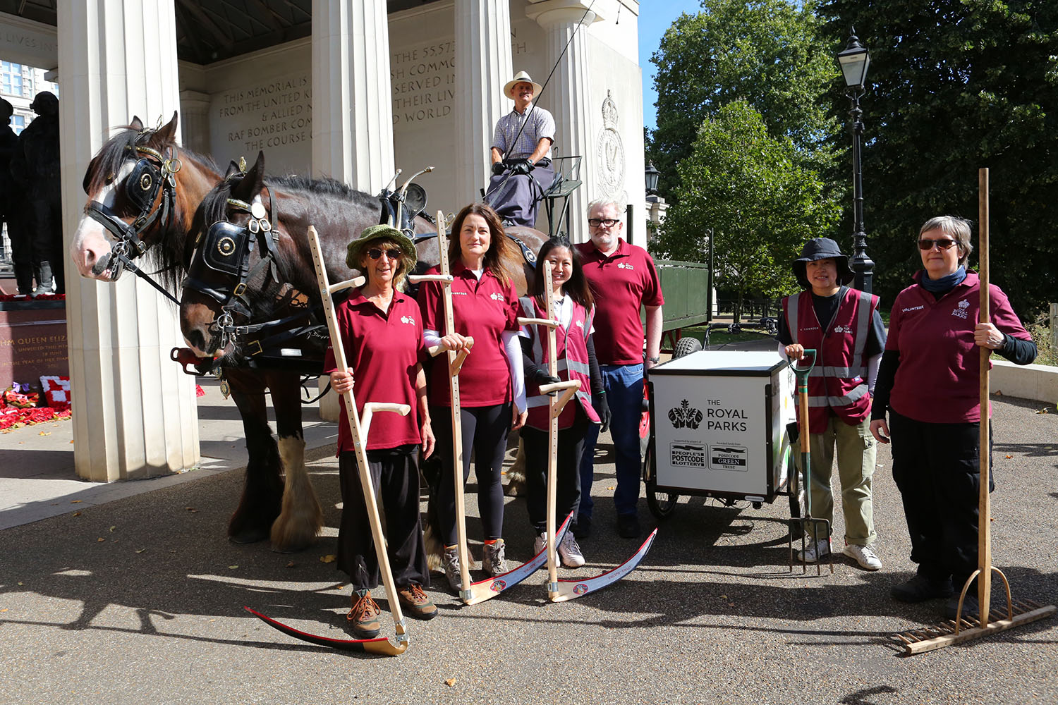 volunteers equipped with scythes and shire horses