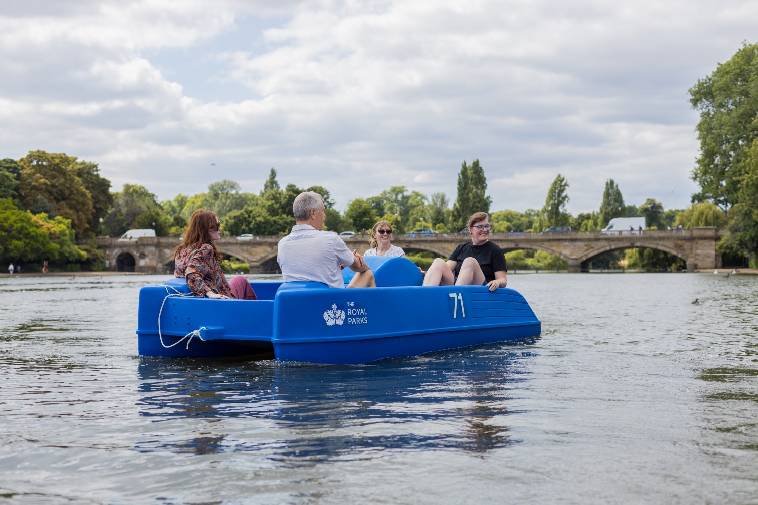 Visitors enjoying a pedalo ride along The Serpentine