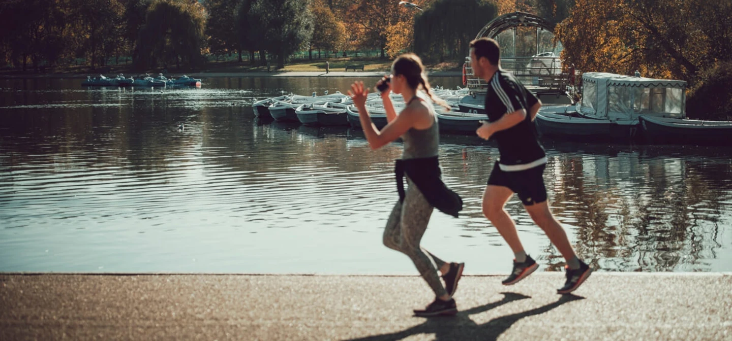 People running by the Serpentine in Hyde Park