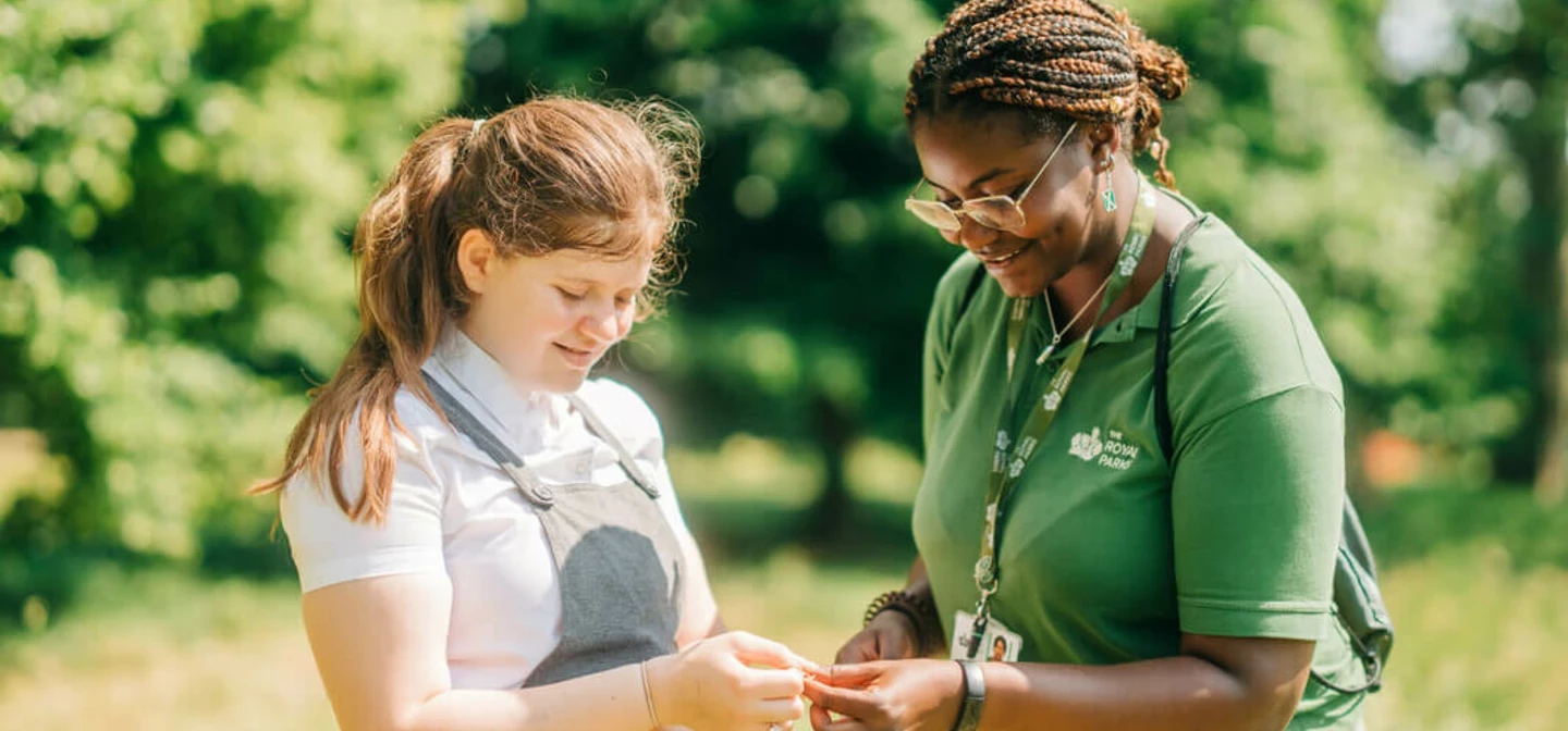 Royal Parks learning officer with student