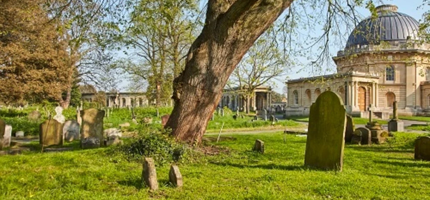 Graves under a tree near the cemetery chapel