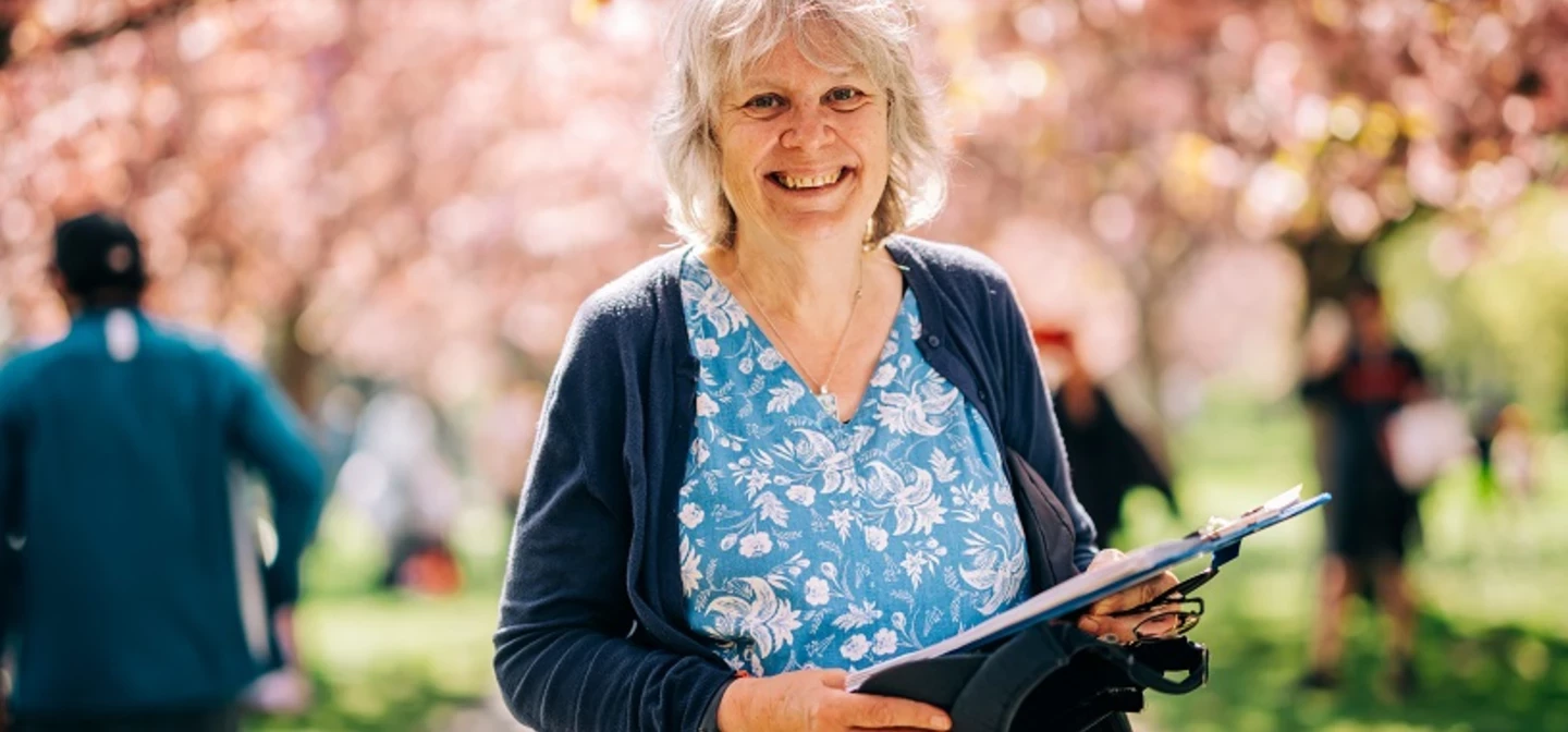 Smiling woman in the park in springtime