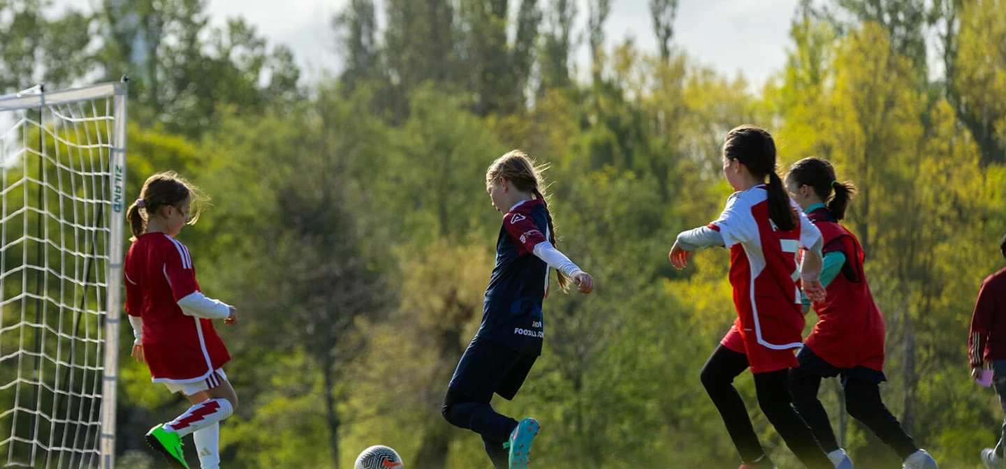 Young girls playing football