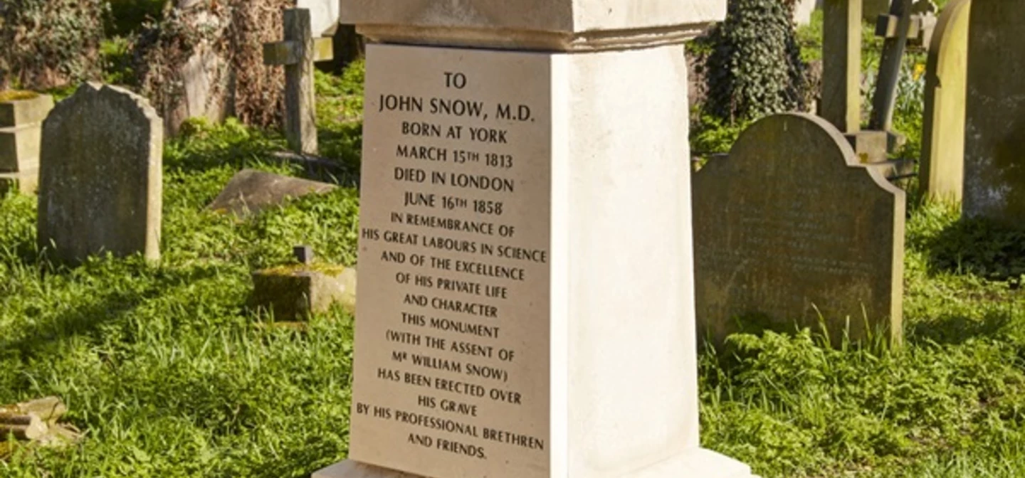 John Snow Grave - White memorial topped with draped urn