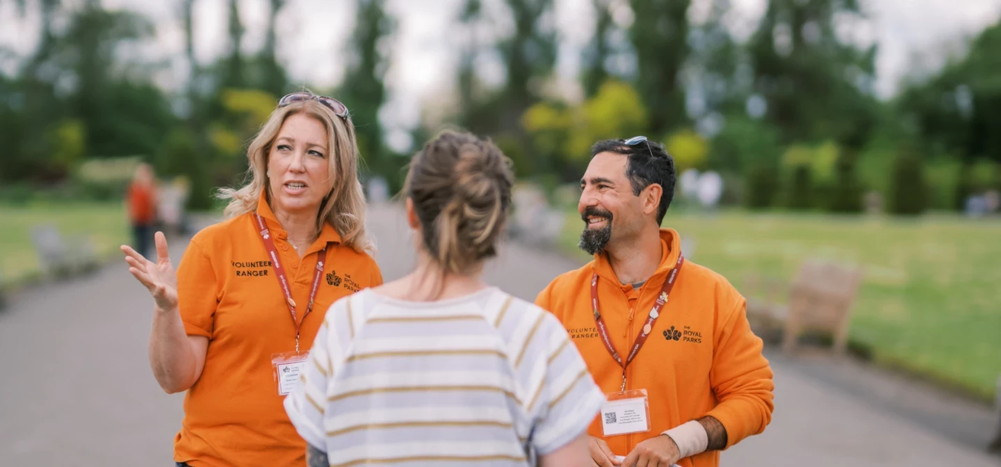 Volunteer Rangers chatting to a park visitor