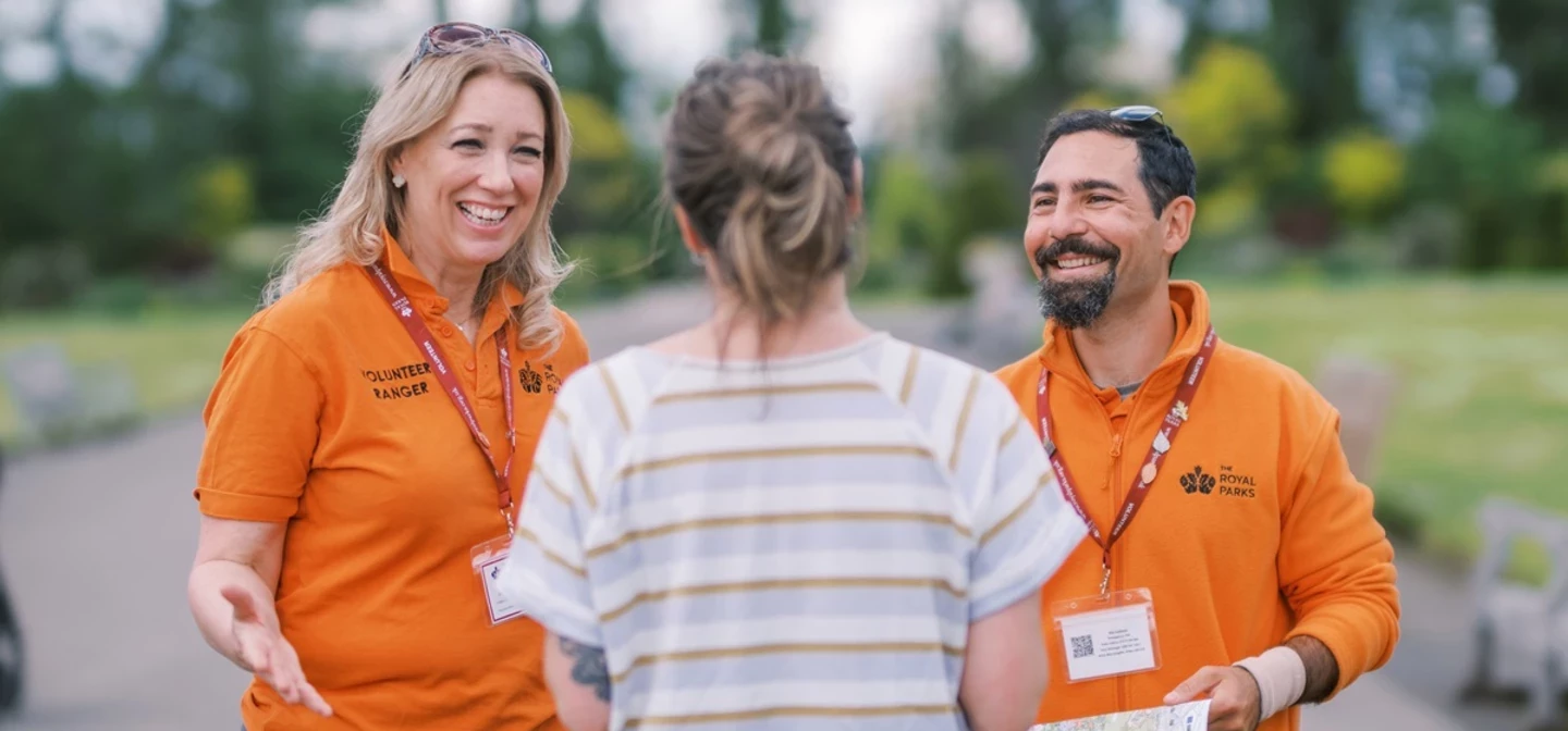 Volunteer Rangers chatting to a park visitor