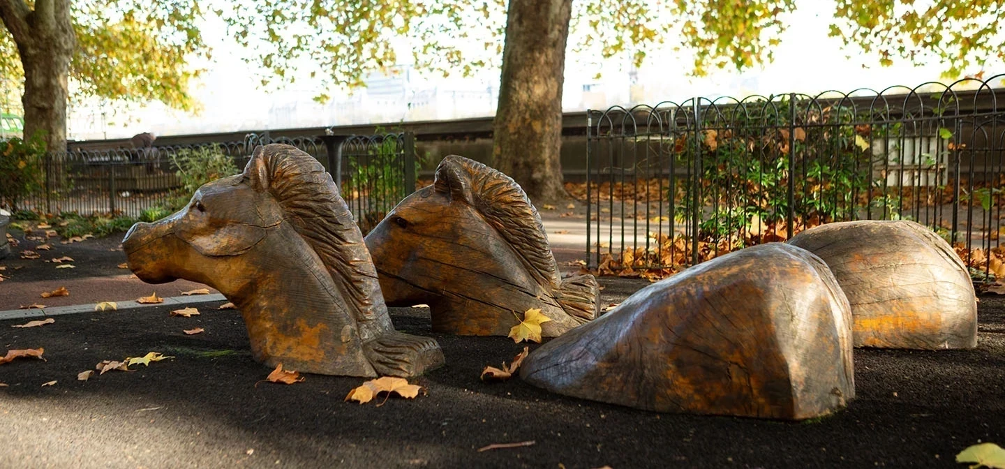 Wooden carved horses at Horseferry playground