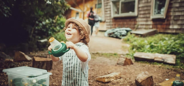 A young child looking for bugs