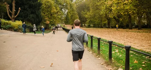 Visitor jogging along Rotten Row in Hyde Park