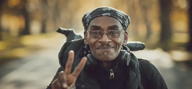 A man giving the peace sign in Hyde Park