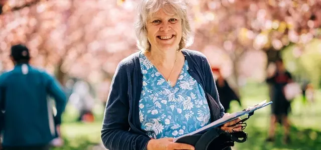 Smiling woman in the park in springtime