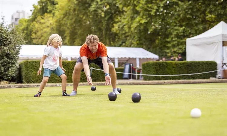 Family enjoying lawn bowls at Park Sports Hyde Park