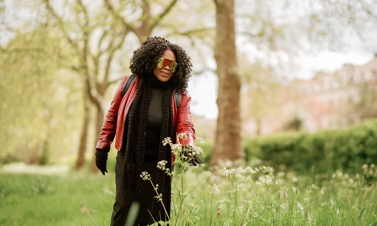 A woman looking at wildflowers