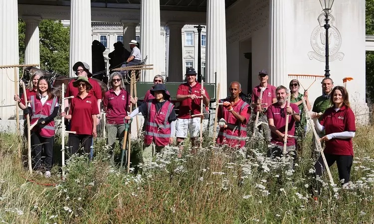 volunteers equipped with scythes and shire horses