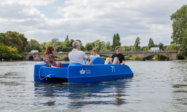 Visitors enjoying a pedalo ride along The Serpentine