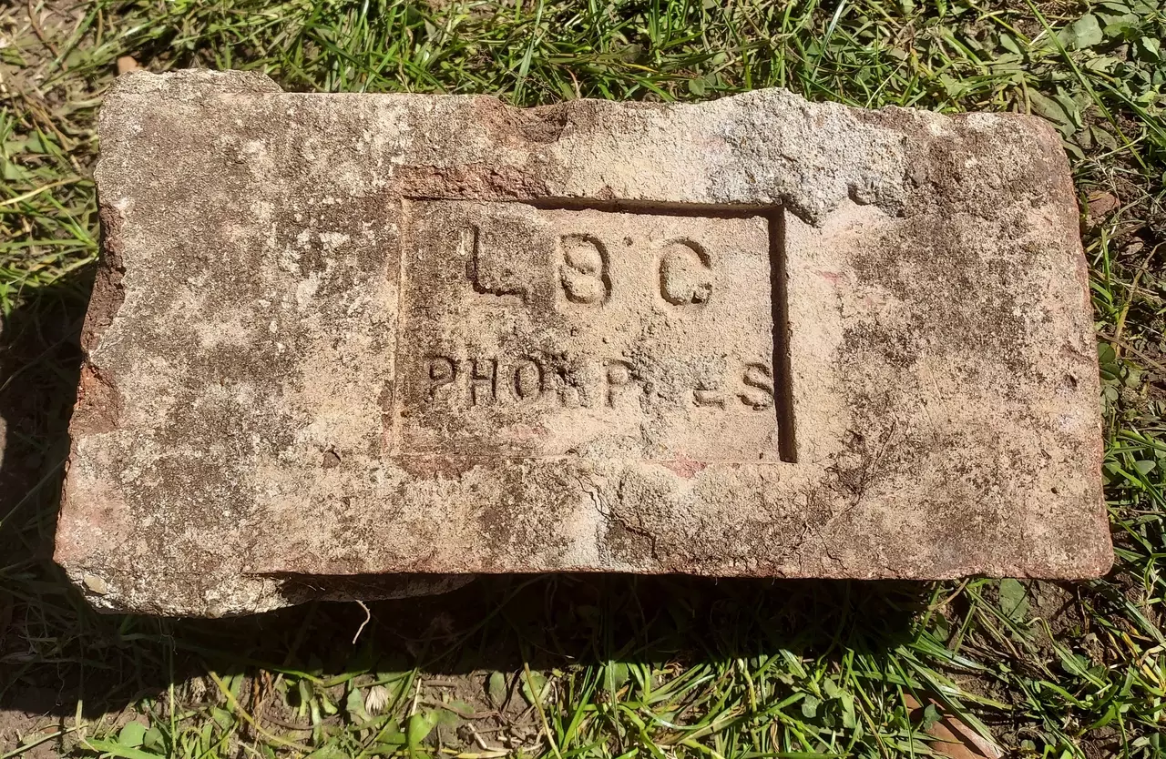 Unusual LBC PHORPRES brick on the grass