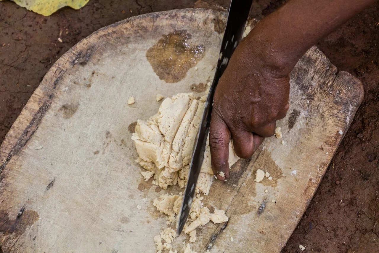 Ethiopian woman preparing kocho bread made with enset 