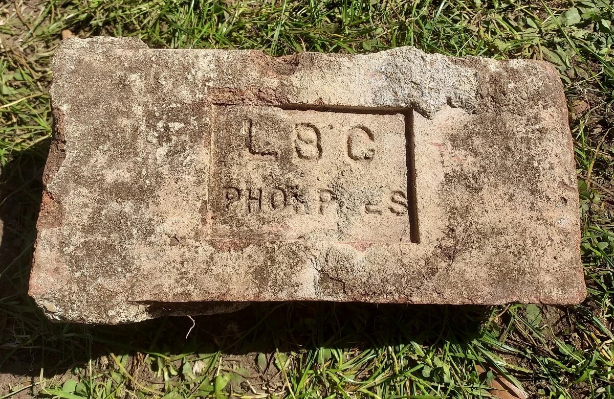 Unusual LBC PHORPRES brick on the grass