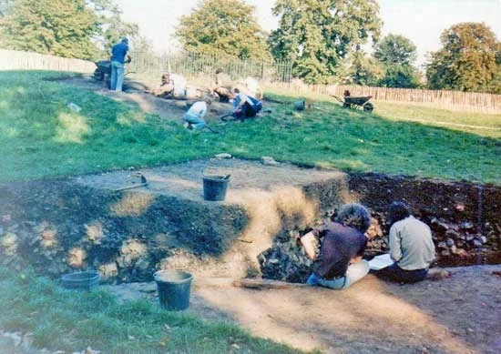 Archaeologists sit on the edge of a trench during a dig at Greenwich Park in 1978