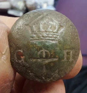 A Greenwich pensioner's button, found during a recent archaeological dig at Greenwich Park - it features an anchor